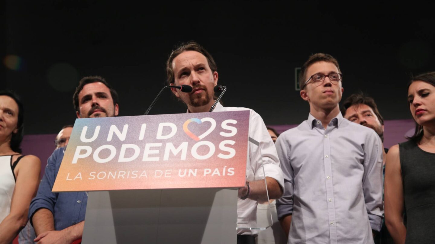 Alberto Garzón, Pablo Iglesias e Iñigo Errejón, en un acto de Podemos.