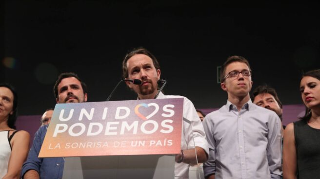 Alberto Garzón, Pablo Iglesias e Iñigo Errejón, en un acto de Podemos.