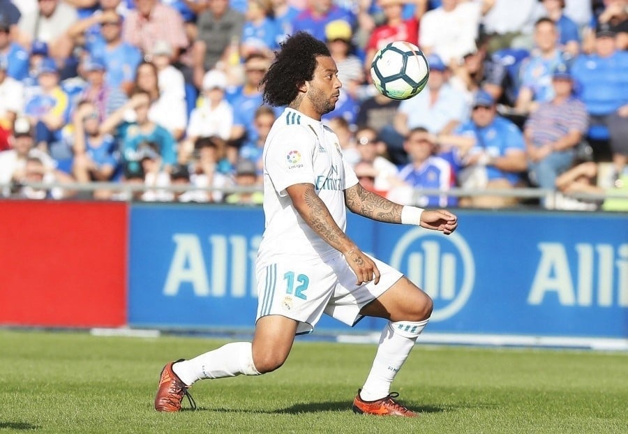 Marcelo, jugador del Real Madrid investigado por elusión fiscal, durante un partido de fútbol.