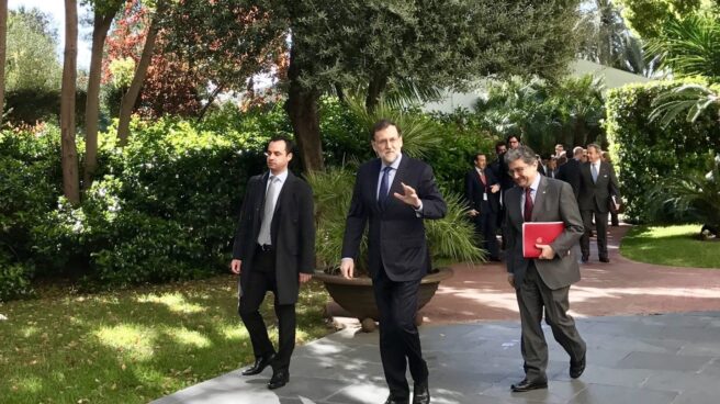 El presidente del Gobierno, Mariano Rajoy, junto al delegado del Gobierno en Cataluña, Enric Millo.