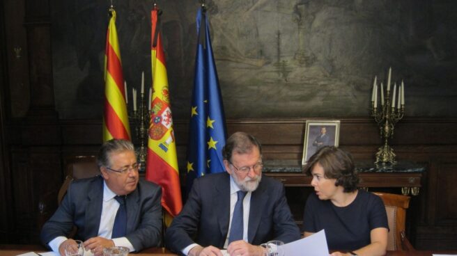 Reunión de Juan Ignacio Zoido, Mariano Rajoy y Soraya Sáenz de Santamaría.