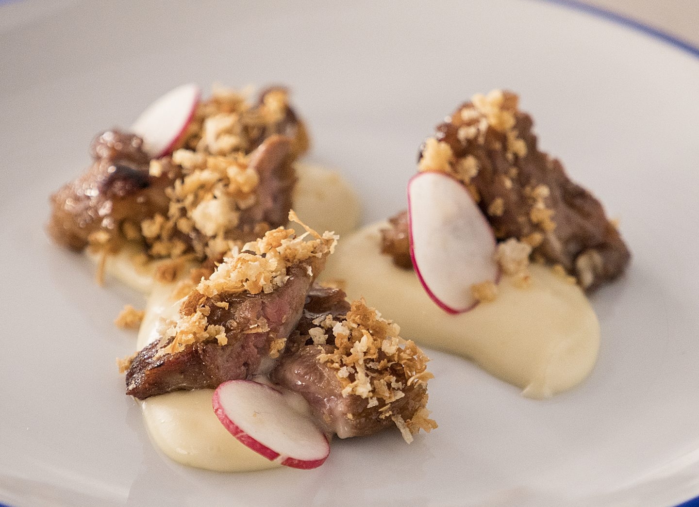 Lagarto ibérico con puré de yuca y esencia de trufa blanca de La Porcinería.