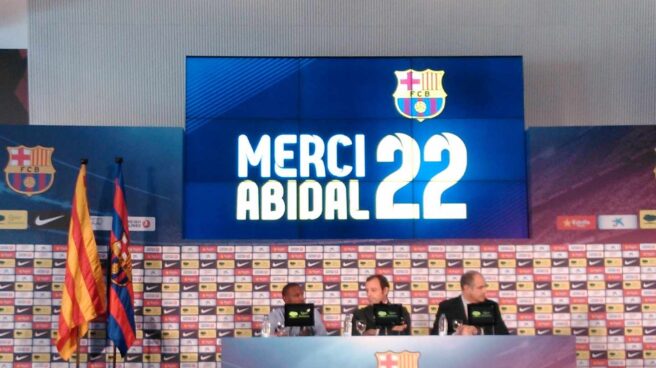 Eric Abidal y Sandro Rosell.