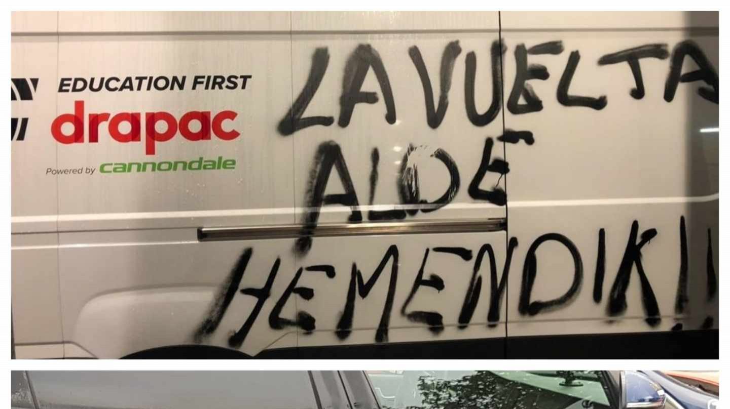 Furgonetas y coches de La Vuelta a España, con pintadas de protesta.