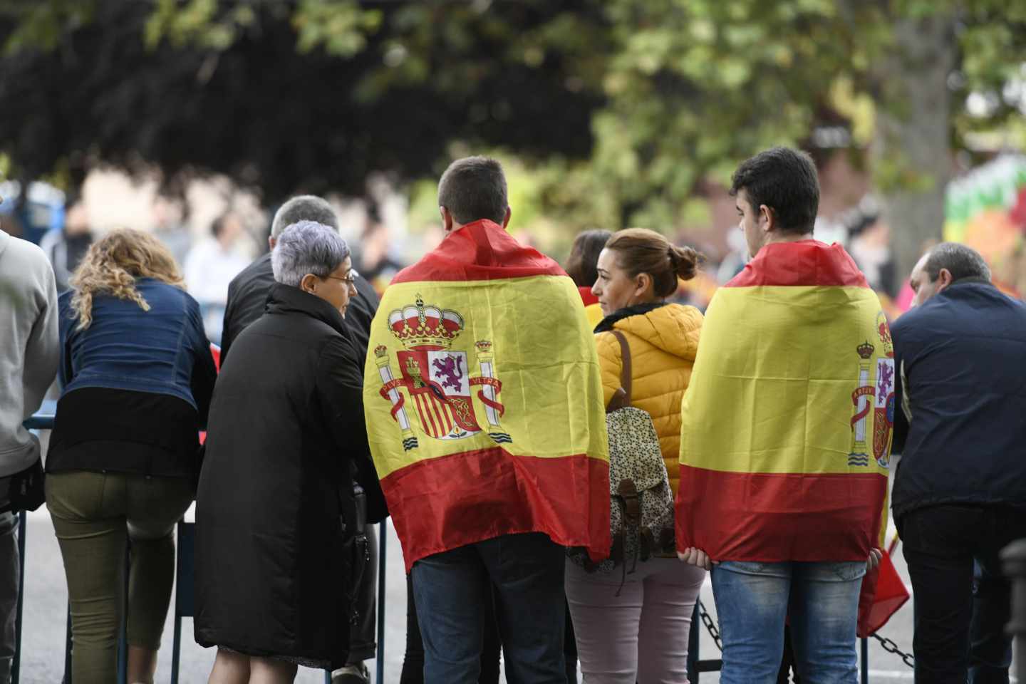 Asistentes al desfile del 12-O en la Castellana de Madrid.