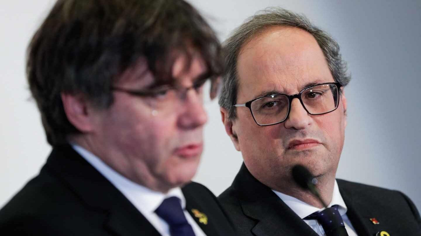 Carles Puigdemont y Quim Torra, durante una rueda de prensa en Bruselas.