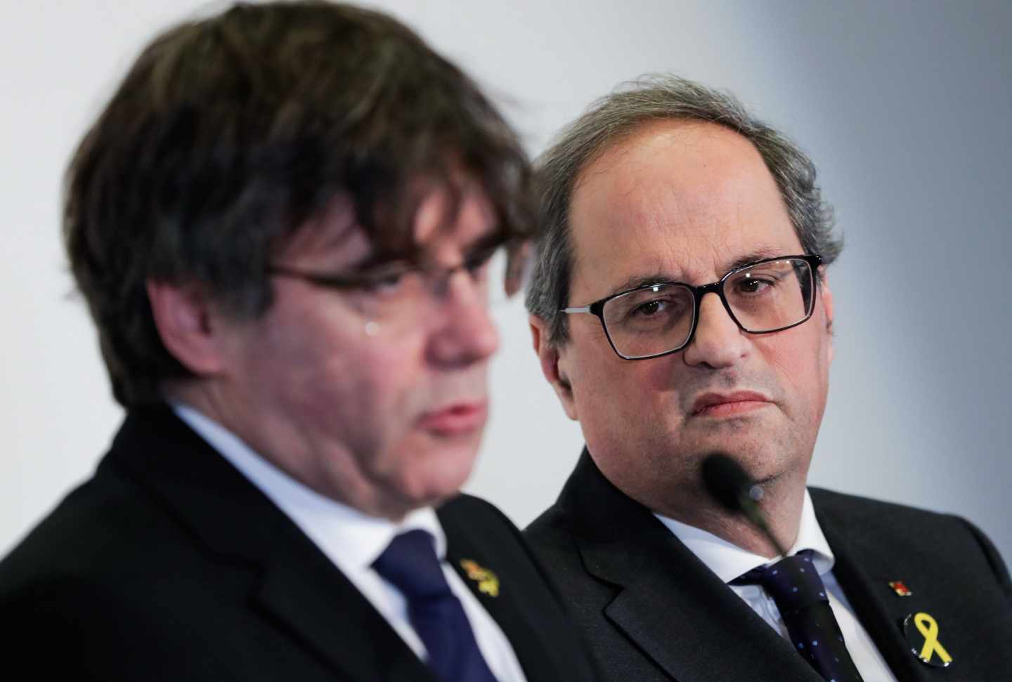 Carles Puigdemont y Quim Torra, durante una rueda de prensa en Bruselas.