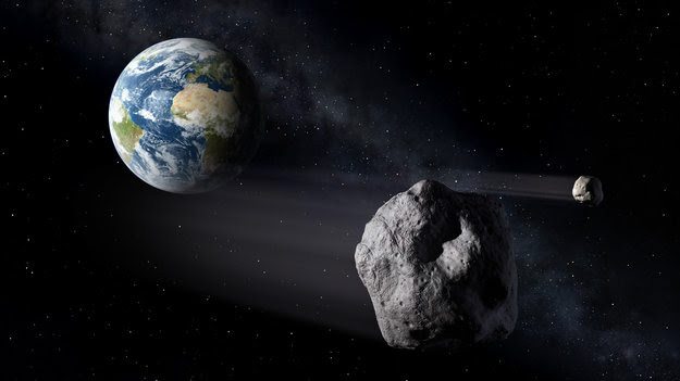 Recreación de un asteroide pasando cerca de la Tierra.