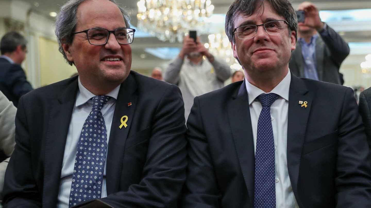 El presidente de la Generalitat de Cataluña, Quim Torra, junto a Carles Puigdemont.