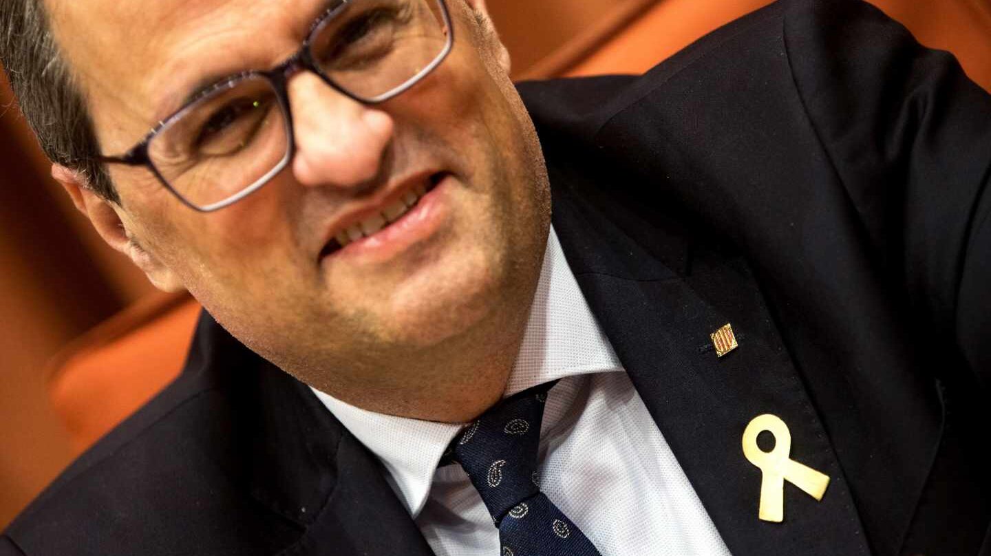 Quim Torra, con un lazo amarillo en la solapa.