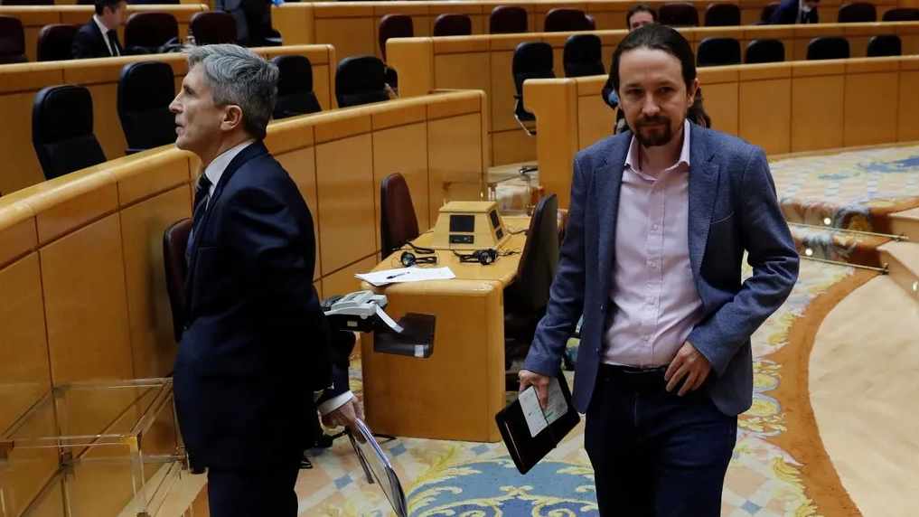 Los ministros Grande-Marlaska y Pablo Iglesias, en el Senado.