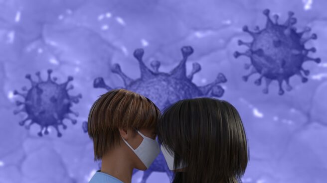 El futuro de las citas tras el Covid-19 Dos personas besándose con la mascarilla y un fondo artificial del coronavirus