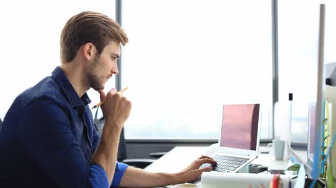 shot-of-handsome-male-architect-working-on-design-in-his-office