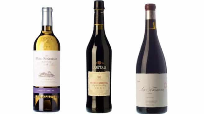Tres botellas de vino en paralelo que corresponden a las mejores calificadas por la Guía Peñín