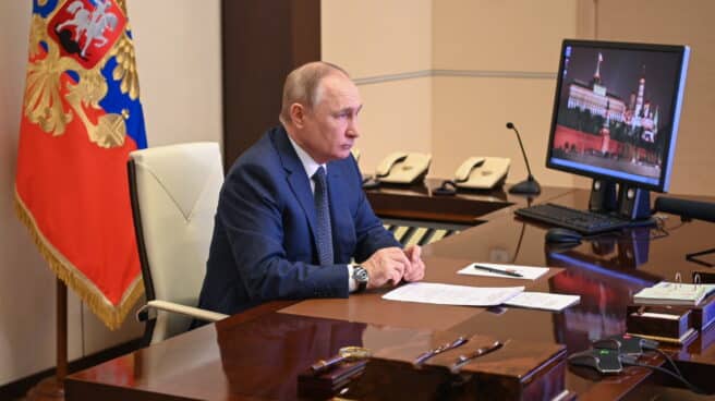 Vladimir Putin attends a ceremony of raising the national flag on the 'Marshal Rokossovsky' ferry in northern Russia