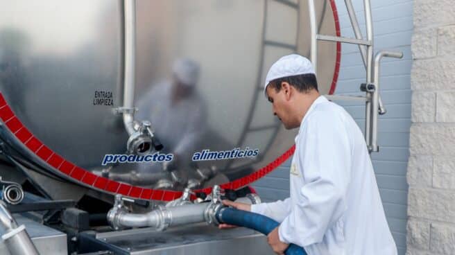 A worker extracts milk at the Suerte Ampanera farm in Colmenar Viejo, Madrid.