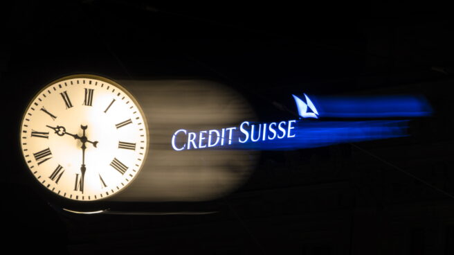 Illuminated logo of the Credit Suisse bank in Zurich.