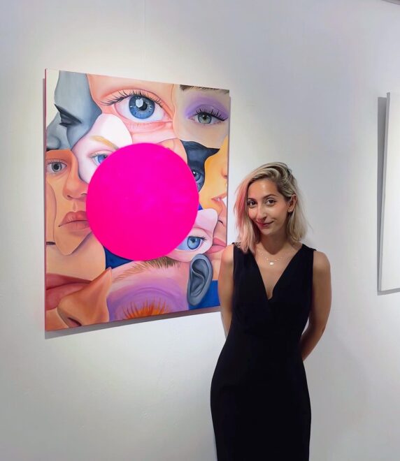 Celia Gallego with one of her paintings.
