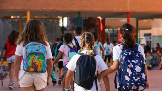 Three girls on arrival at school in Madrid.