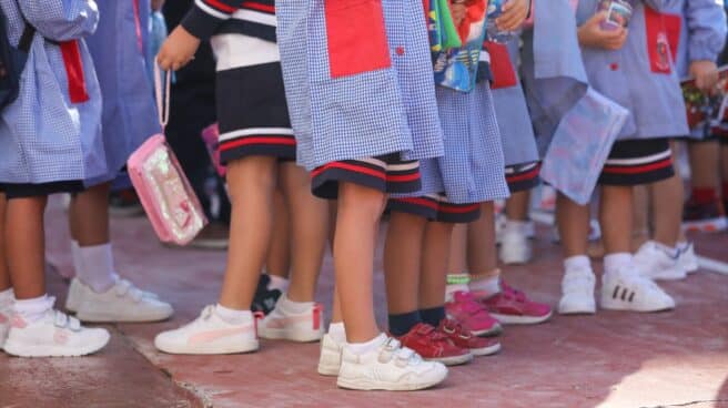 Several children on the playground on the start of the school year at the Alameda de Osuna school in Madrid.