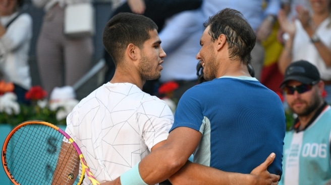 Carlos Alcaraz con Rafa Nadal Carlos Alcaraz con Rafa Nadal
