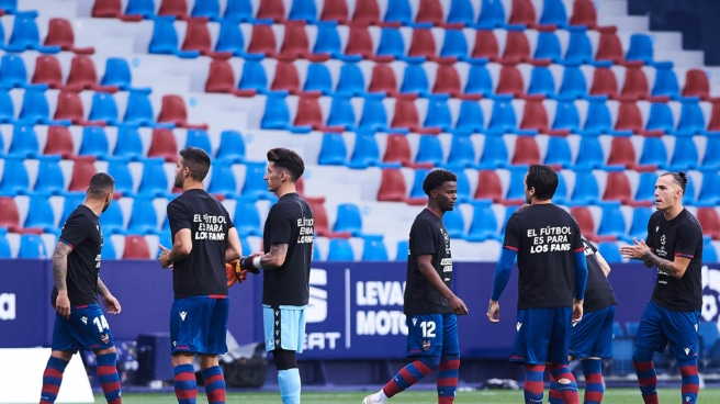 Players from Levante and Sevilla wear a T-shirt with the slogan 