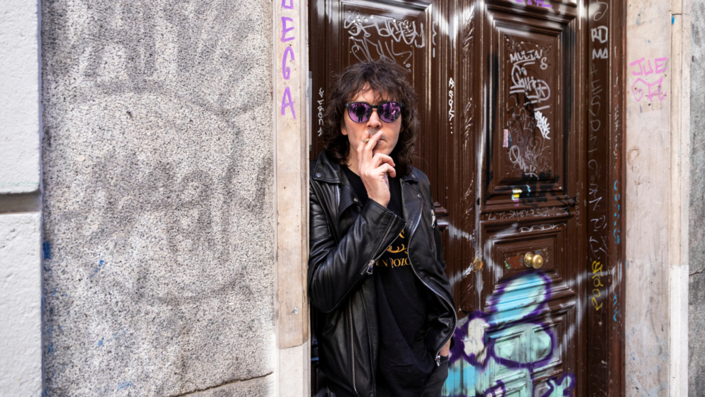 Ruben Pozo smokes a cigarette on the street.